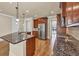 Spacious kitchen with granite counters, stainless steel appliances, and hardwood floors at 3810 Baverton Dr, Suwanee, GA 30024