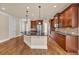 Spacious kitchen with granite counters, stainless steel appliances, and hardwood floors at 3810 Baverton Dr, Suwanee, GA 30024