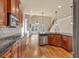 Open kitchen with granite counters, stainless appliances, hardwood floors, open to living area at 3810 Baverton Dr, Suwanee, GA 30024