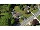 Aerial view showing the home's location relative to the road and surrounding trees at 72 Grayson New Hope Rd, Grayson, GA 30017