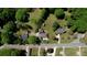 Aerial view showing the home's location, yard, trees, and proximity to the road at 72 Grayson New Hope Rd, Grayson, GA 30017