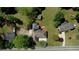 Aerial view showcasing the home's layout, surrounding greenery, and neighborhood at 72 Grayson New Hope Rd, Grayson, GA 30017