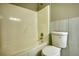 Clean bathroom featuring a tub, toilet, and neutral-colored walls at 72 Grayson New Hope Rd, Grayson, GA 30017