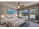 Serene bedroom featuring calming artwork, plush bedding, and bright windows at 72 Grayson New Hope Rd, Grayson, GA 30017