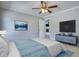 Comfortable bedroom with a ceiling fan, a TV, and carpet flooring for a cozy retreat at 72 Grayson New Hope Rd, Grayson, GA 30017