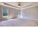 Spacious bedroom features natural light from two windows, ceiling fan and crown molding at 72 Grayson New Hope Rd, Grayson, GA 30017