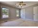 Bedroom with neutral walls, carpet flooring, windows and closet at 72 Grayson New Hope Rd, Grayson, GA 30017
