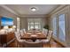 Elegant dining room features stylish furnishings, hardwood floors, and natural lighting at 72 Grayson New Hope Rd, Grayson, GA 30017