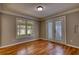 Cozy dining room featuring hardwood flooring, large windows, and glass paneled french doors at 72 Grayson New Hope Rd, Grayson, GA 30017