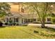 Inviting home with beautiful landscaping, a flag pole, and a well-manicured lawn at 72 Grayson New Hope Rd, Grayson, GA 30017