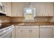 Bright kitchen featuring white appliances, white cabinets, and granite countertops at 72 Grayson New Hope Rd, Grayson, GA 30017