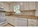 Bright kitchen featuring white appliances, white cabinets, and granite countertops at 72 Grayson New Hope Rd, Grayson, GA 30017