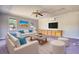 Inviting living room with neutral furniture, a built-in cabinet, and a ceiling fan at 72 Grayson New Hope Rd, Grayson, GA 30017