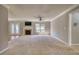 Bright living room with a cozy fireplace and access to the outside through glass paneled doors at 72 Grayson New Hope Rd, Grayson, GA 30017