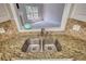 Close-up of a kitchen sink with granite countertops and view to the Gathering room at 72 Grayson New Hope Rd, Grayson, GA 30017