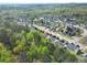 Expansive aerial view of a suburban community surrounded by lush greenery and mature trees at 205 E Skyline Vw, Dallas, GA 30157