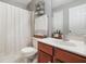Bathroom with cherry vanity, walk-in shower and tiled shower curtain at 205 E Skyline Vw, Dallas, GA 30157