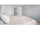 Spacious bedroom with plush carpet and a view of the closet and entryway door at 205 E Skyline Vw, Dallas, GA 30157