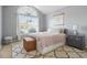 Bedroom with neutral paint, vaulted ceiling, large window and decorative rug at 205 E Skyline Vw, Dallas, GA 30157