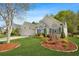 Beautiful home with a manicured lawn and landscaping, featuring large windows and a two-car garage at 205 E Skyline Vw, Dallas, GA 30157