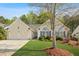 Charming home featuring a well-manicured lawn, a two-car garage, and large windows with blue shutters at 205 E Skyline Vw, Dallas, GA 30157