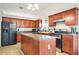 Functional kitchen with stainless steel appliances, a center island, and ample cabinet space at 205 E Skyline Vw, Dallas, GA 30157