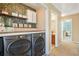 Laundry room featuring updated washer and dryer, shelving and wood counters at 205 E Skyline Vw, Dallas, GA 30157