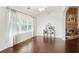 Spacious living room area featuring a decorative fireplace, hardwood floors, and ample natural light at 205 E Skyline Vw, Dallas, GA 30157