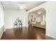 Open-concept living area with hardwood floors leads to another living space with a beautiful fireplace at 205 E Skyline Vw, Dallas, GA 30157