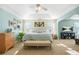Bright bedroom with tray ceiling, a king bed, and soft blue accents at 205 E Skyline Vw, Dallas, GA 30157