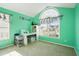 Office with vaulted ceilings, two windows and bright teal walls at 205 E Skyline Vw, Dallas, GA 30157