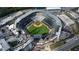 Overhead shot of a baseball stadium featuring green field and seating surrounded by city streets and buildings at 2659 Lakefield Sw Pass, Marietta, GA 30064