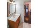 Bathroom with a vanity sink, a tiled floor, and a view of the hallway at 2659 Lakefield Sw Pass, Marietta, GA 30064