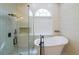 Luxurious bathroom featuring a soaking tub and separate shower with a glass door at 2659 Lakefield Sw Pass, Marietta, GA 30064