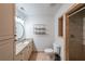 Bathroom featuring granite counters, a framed mirror, and ceramic tile floors at 2659 Lakefield Sw Pass, Marietta, GA 30064
