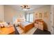 Cozy bedroom is decorated with wooden furniture and natural light from windows at 2659 Lakefield Sw Pass, Marietta, GA 30064