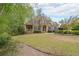 Beautiful brick home with a well-manicured front lawn and mature landscaping at 2659 Lakefield Sw Pass, Marietta, GA 30064