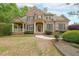 Beautiful brick home with manicured lawn and inviting front porch at 2659 Lakefield Sw Pass, Marietta, GA 30064