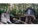 Scenic view of historic grist mill beside a waterfall surrounded by lush greenery in a serene setting at 2659 Lakefield Sw Pass, Marietta, GA 30064