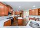 Spacious kitchen featuring stainless steel appliances, a central island, and cherry wood cabinetry at 2659 Lakefield Sw Pass, Marietta, GA 30064