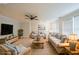 Living room featuring a ceiling fan, neutral walls, and comfortable seating arrangement at 2659 Lakefield Sw Pass, Marietta, GA 30064