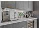 Elegant bar area with a wine cooler, espresso machine, and stylish countertop at 40 12Th Ne St # 903, Atlanta, GA 30309