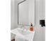 Contemporary half-bath featuring a stylish mirror and sink, and hardwood floors at 40 12Th Ne St # 903, Atlanta, GA 30309