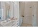 Modern bathroom with a glass-enclosed shower and sleek vanity with chrome fixtures at 40 12Th Ne St # 903, Atlanta, GA 30309
