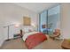 Serene bedroom with large windows offering a view of an outdoor patio at 40 12Th Ne St # 903, Atlanta, GA 30309