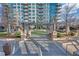 An outdoor courtyard with seating, pergolas, manicured greenery, and access to the building's amenities at 40 12Th Ne St # 903, Atlanta, GA 30309