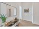 Entryway features a stylish mirror, console table, and artwork, with hardwood floors at 40 12Th Ne St # 903, Atlanta, GA 30309