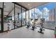 Gym with cardio equipment, floor-to-ceiling windows and city views at 40 12Th Ne St # 903, Atlanta, GA 30309