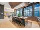 Modern kitchen area featuring granite island, bar seating and floor-to-ceiling windows at 40 12Th Ne St # 903, Atlanta, GA 30309