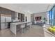 Bright, airy living room flows into the open kitchen with modern finishes and city views at 40 12Th Ne St # 903, Atlanta, GA 30309